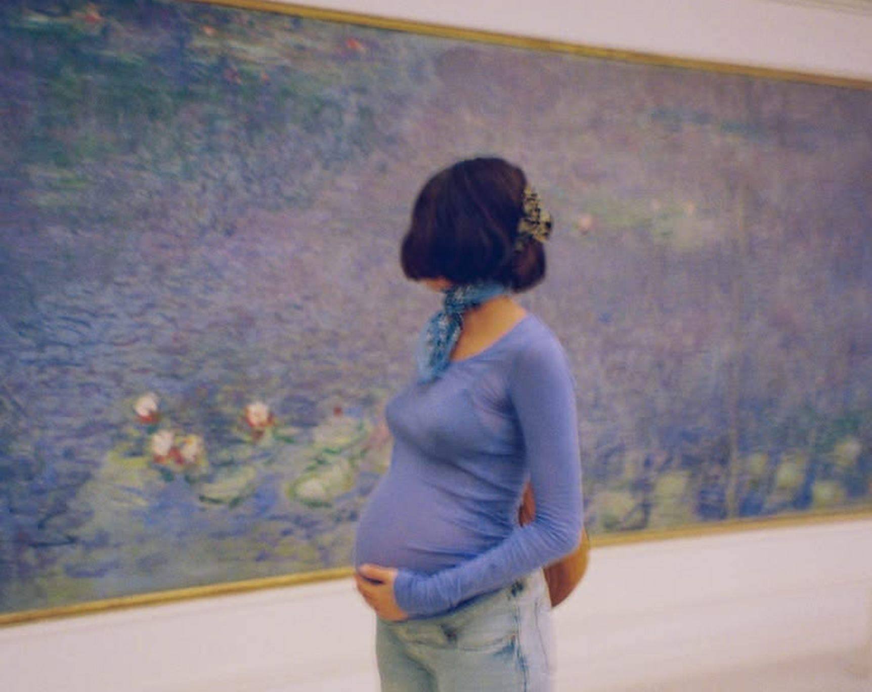 Pregnant woman in a reflection on how where we live can shape the experience of pregnancy.