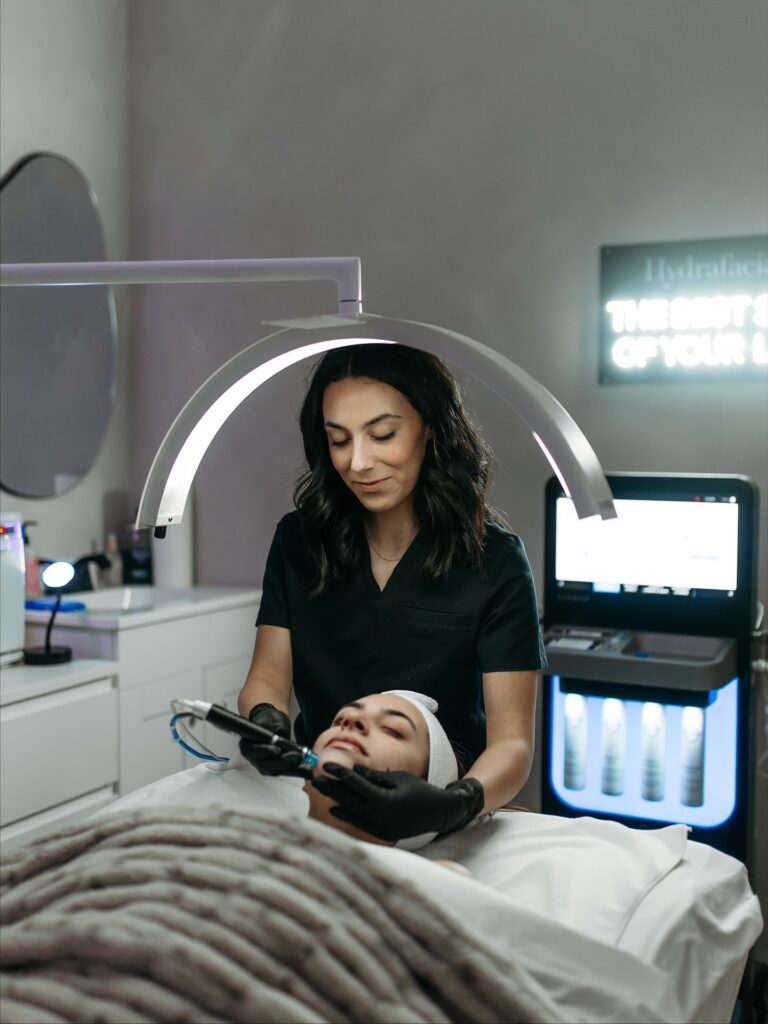 Hydrafacial treatment performed during a skin care procedure focused on Skin Health.