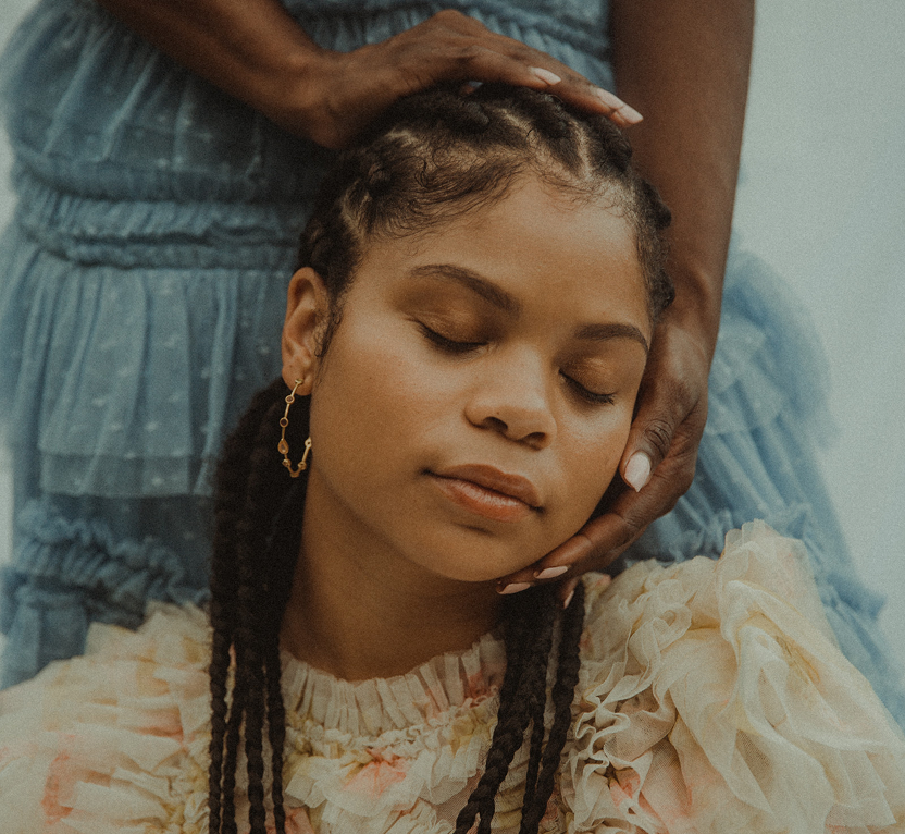 Two sisters pictured together in a reflection on identity, belonging, and birth order