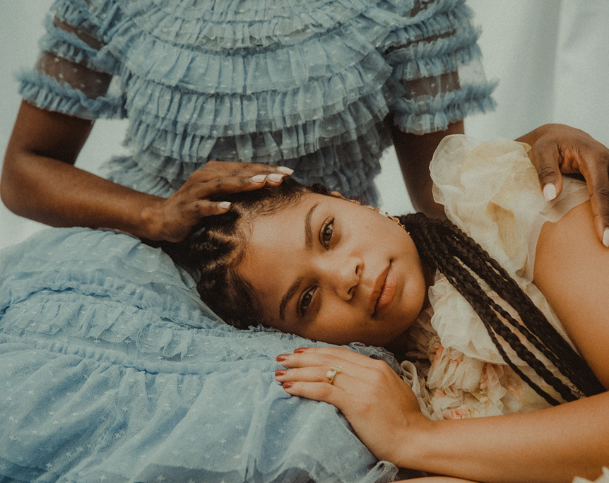 Two sisters together in an image exploring the youngest daughter, family roles, and identity